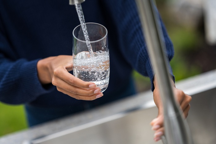 filling glass of water