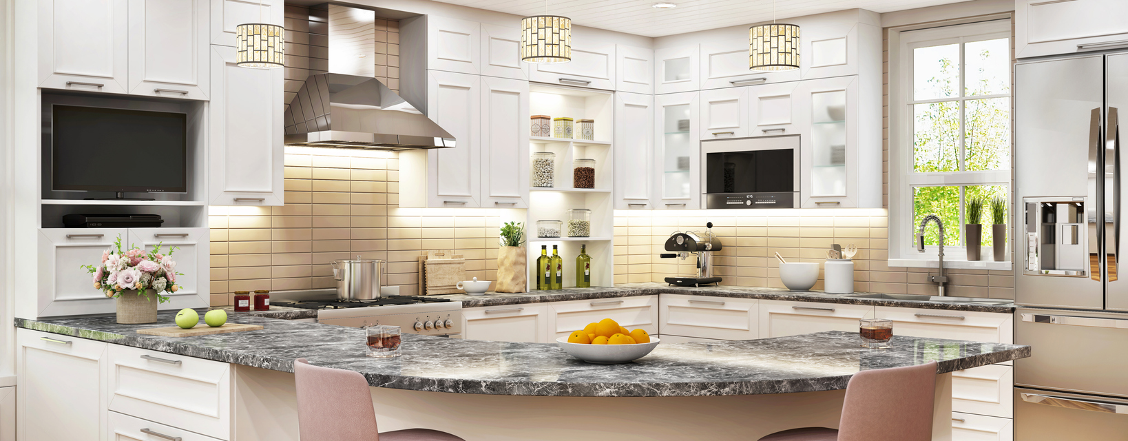 Large, luxurious white kitchen with marble countertop and stainless steel kitchen appliances. 