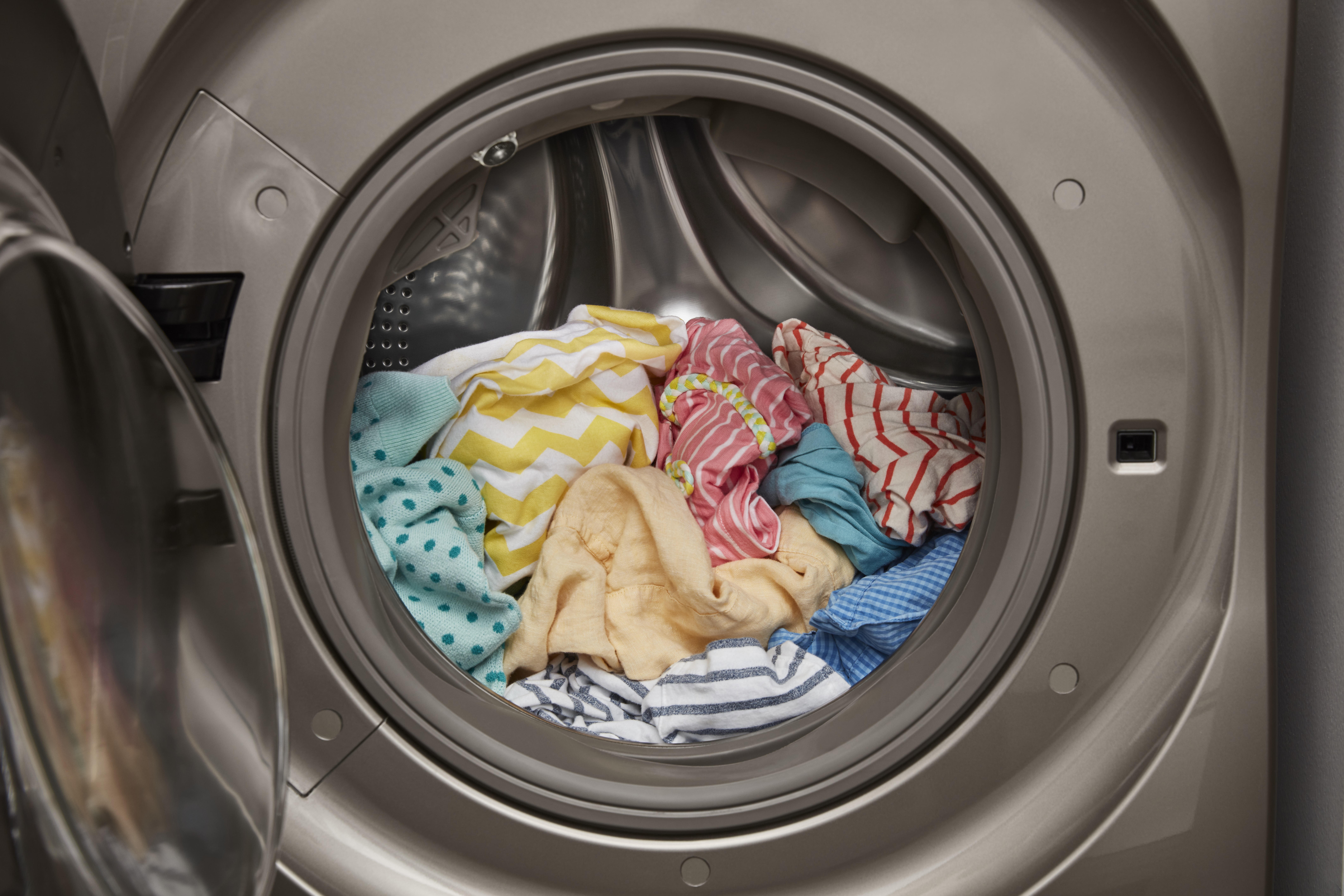 interior view of dryer drum with clothes inside