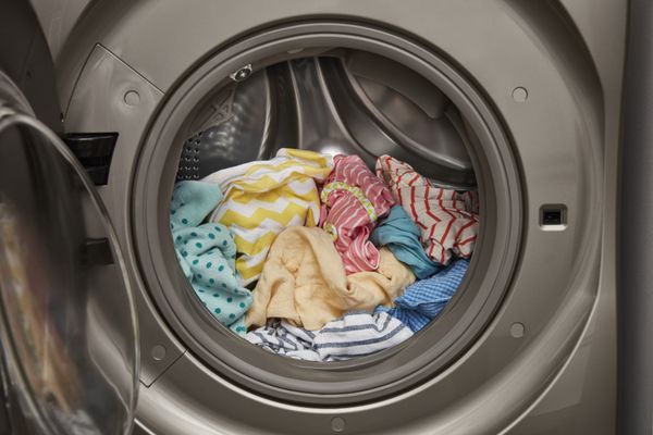 colorful clothing inside front-loading Whirlpool washer-dryer combo