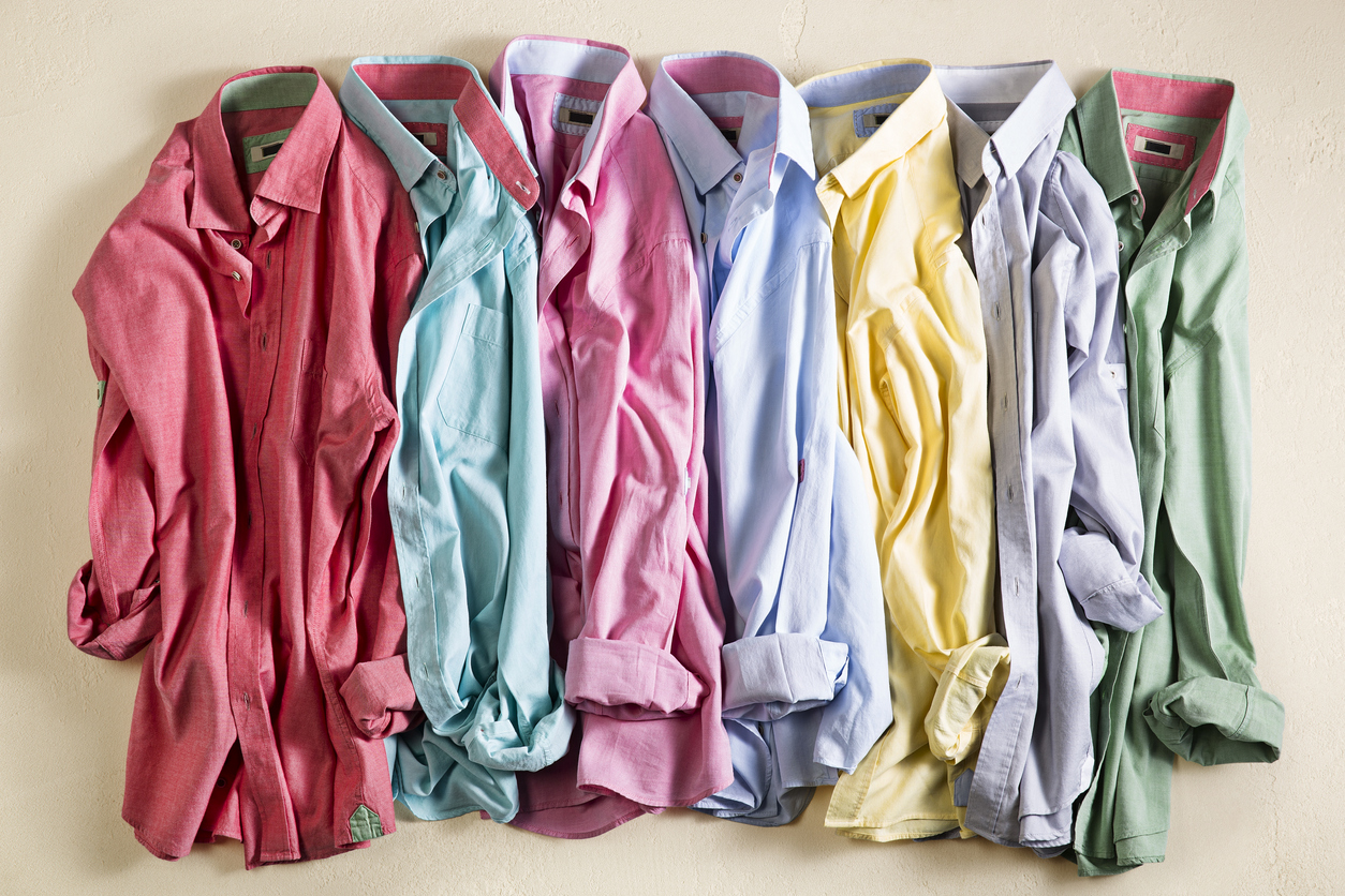 wrinkled men’s shirts in an assortment of colors 