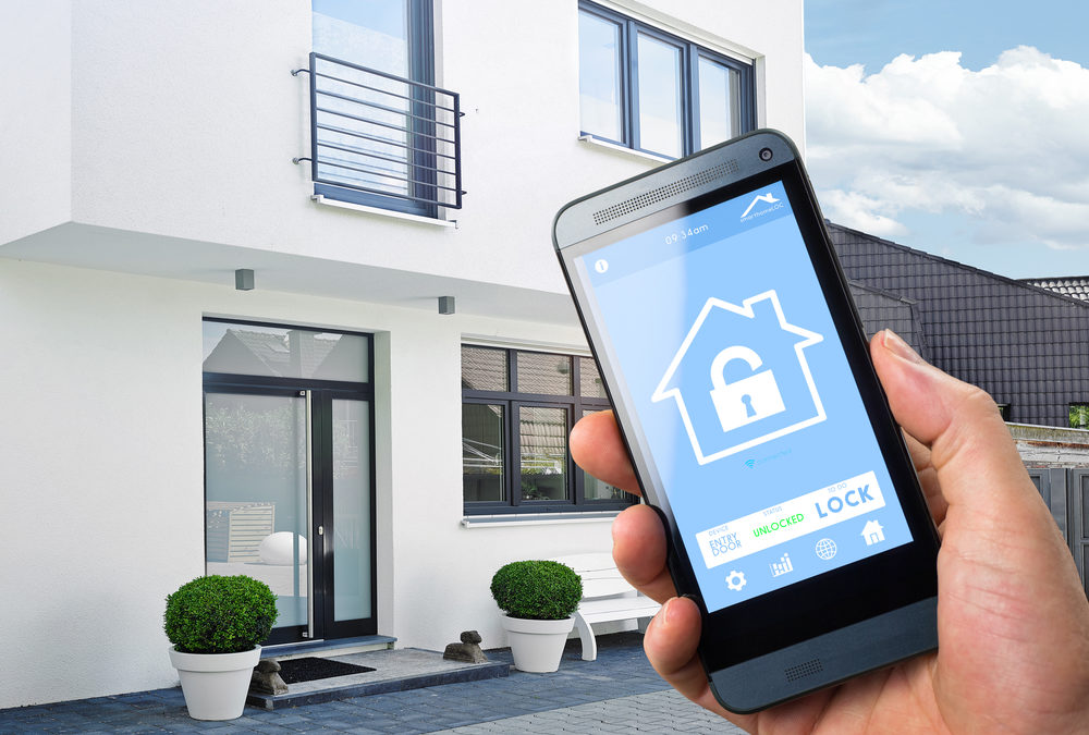 Phone showing a home security app with the home in the background
