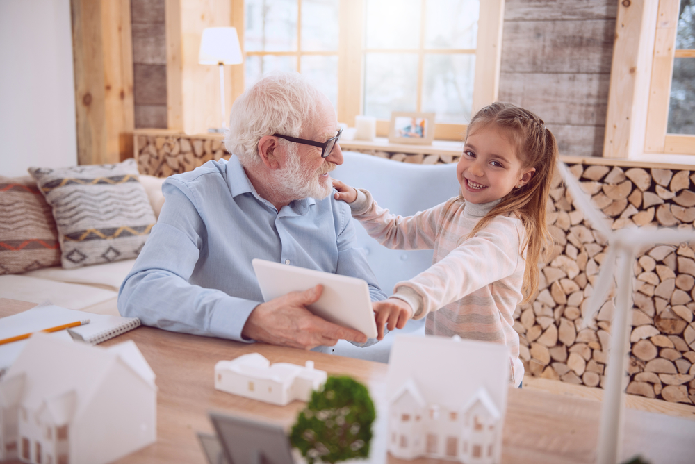an older man with his granddaughter