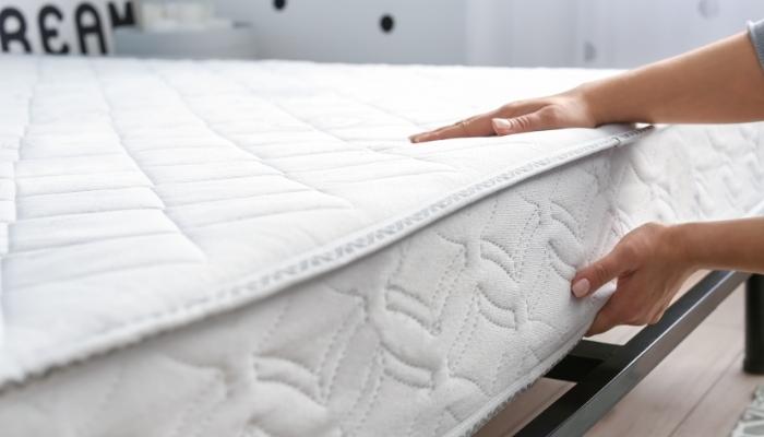Hand feeling new mattress
