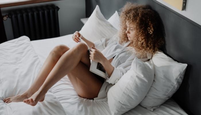 woman relaxing on bed
