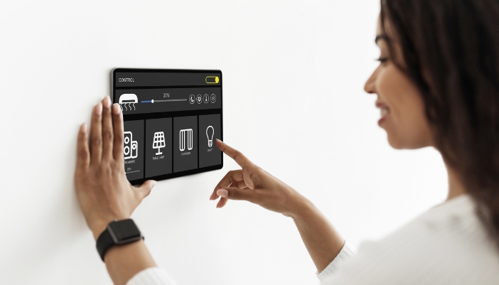 Woman changing the audio settings on her smart panel