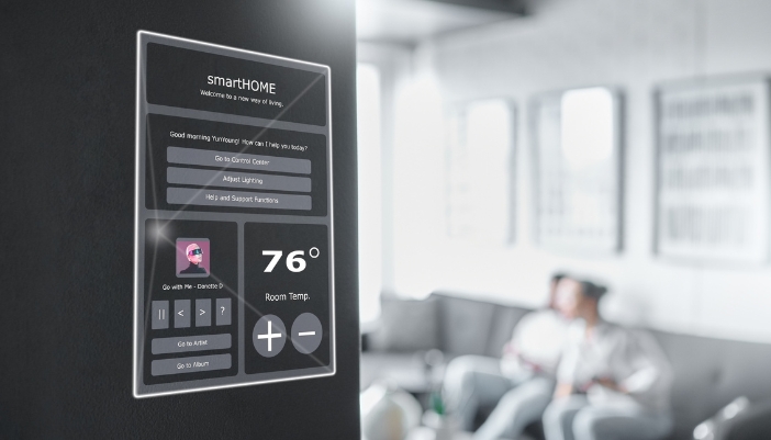A sleek control panel waiting for a voice command from the people sitting on the couch