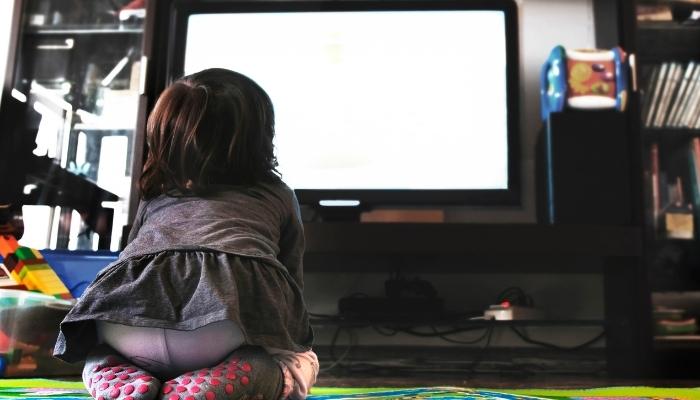 Baby sitting in front of TV
