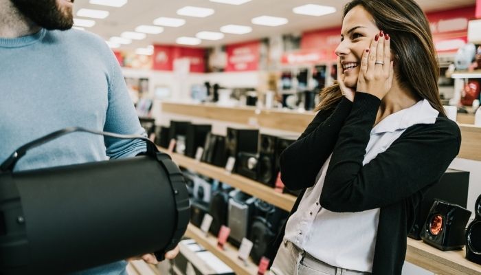 couple shopping for speakers