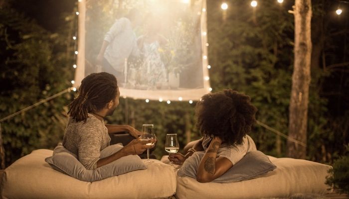 couple watching videos outside