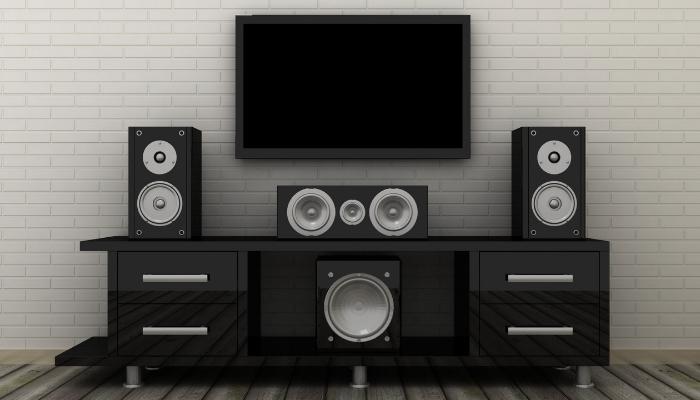 Sound system with woofer in the front and bottom center