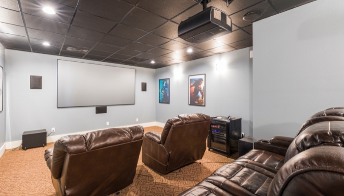 Home theater showing source components in a cabinet