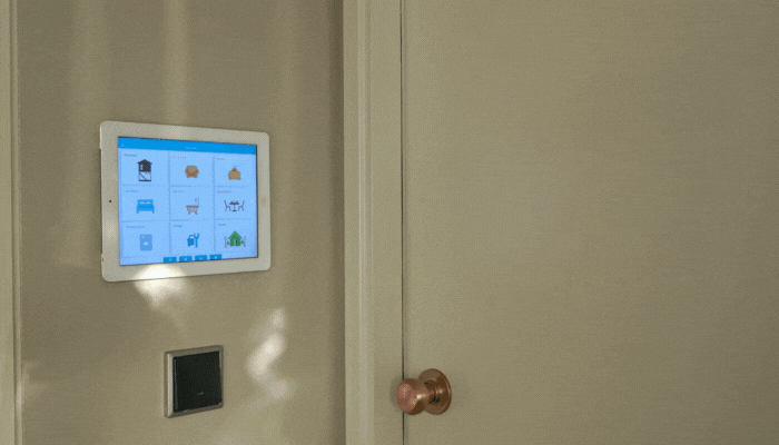 Closeup of someone turning on the lights with control panel