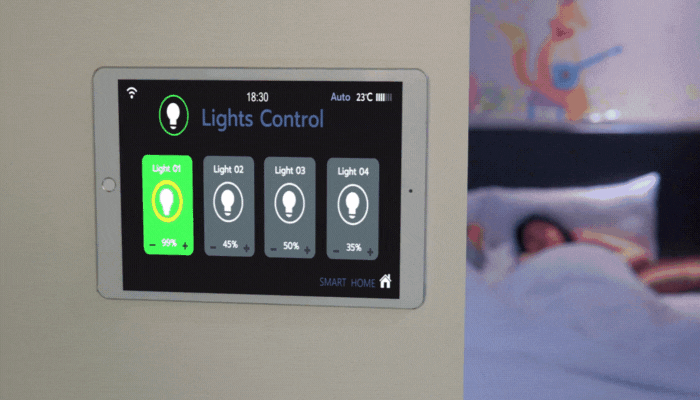 Woman turns on lights using smartwatch to get a glass of wine from the fridge