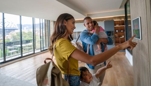 Family Using Smart Home Touchpad