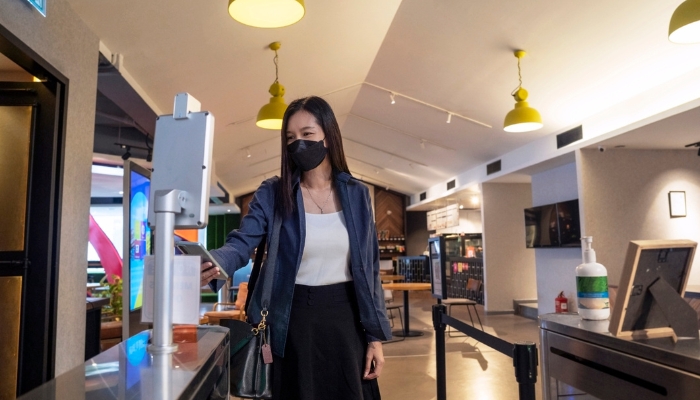 Woman using smartphone to access the office