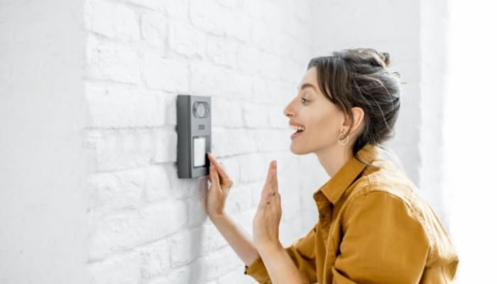 Woman talking into video doorbell