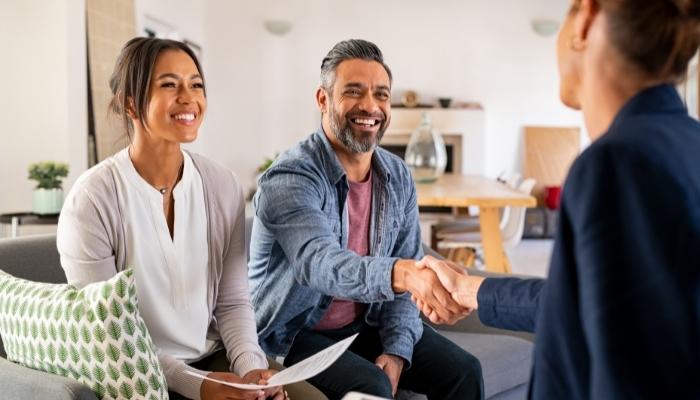 Couple smiling during a consultation