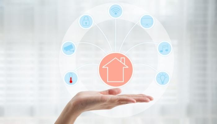 Smart home tech symbols in the palm of a hand