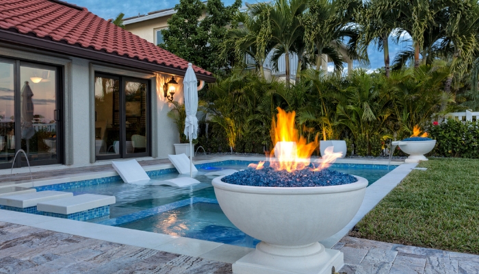 Back patio with multiple fire pits lit at the same time