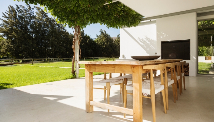 Outdoor patio space with built-in outdoor TV and seating