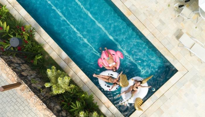 Group of friends lounging by the pool