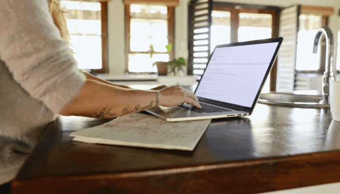 Woman receives alert for delivery to her front door in real time as she works from home