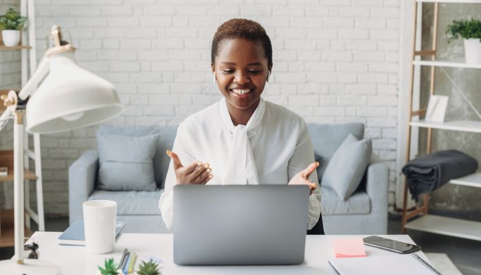 woman communicating virtually in home office