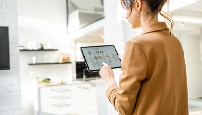 Woman looking over her smart network hub