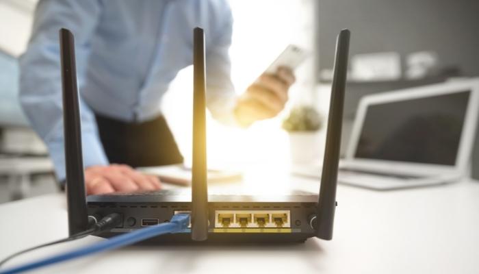 Man checking out his router connection