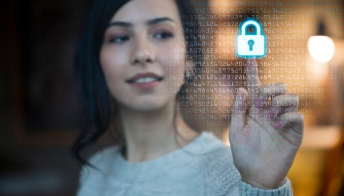 Woman touching a lock symbol of her secure network