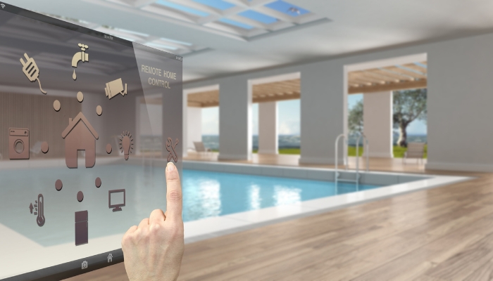 Concept image of someone controlling the pool through a smart device panel