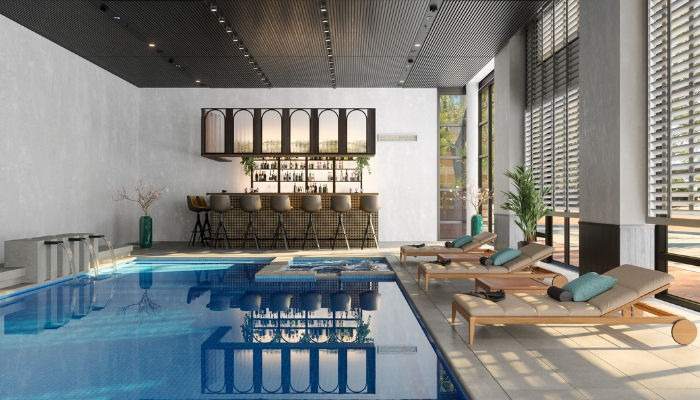 Luxury pool indoors with waterfalls and a home bar