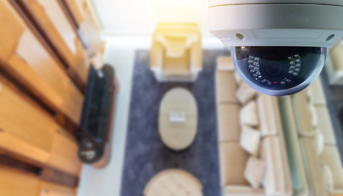 Closeup of security camera over palatial living room