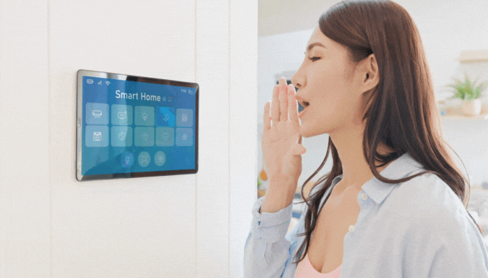 Woman turn tells the control panel to show her the power usage and makes adjustments