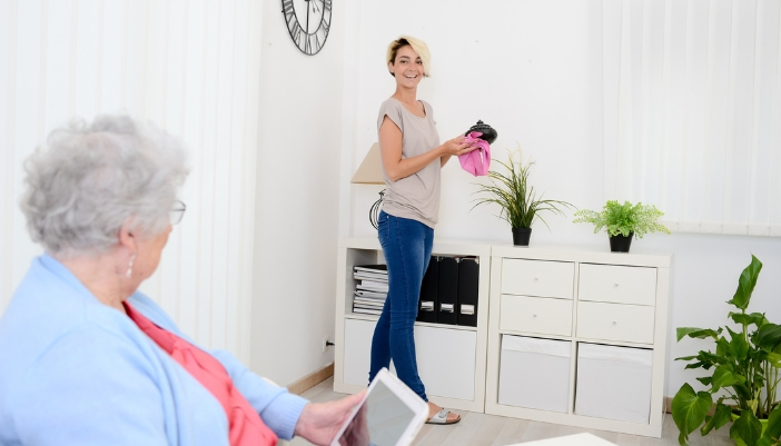 An elderly woman and young woman hanging out