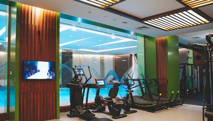 A luxury fitness center with ideal environmental settings per area