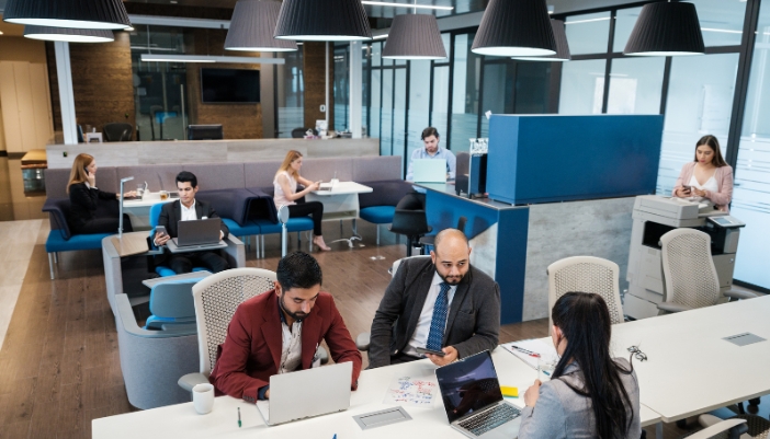 A busy, open corporate office filled with noise