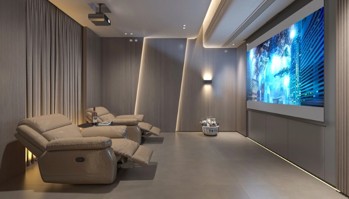 A luxury home theater with two reclines and blackout curtains