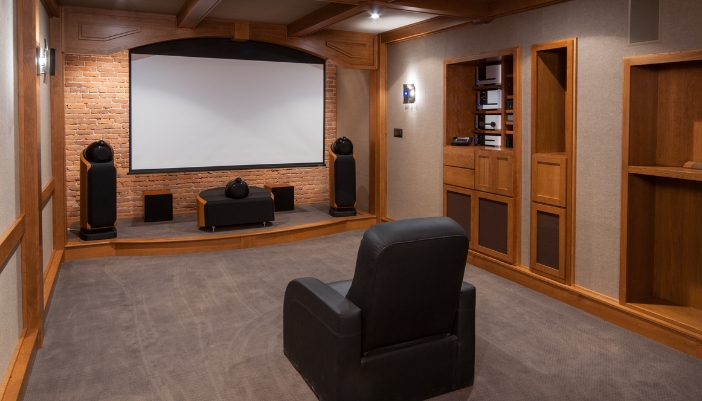 A home theater with a unique flooring design