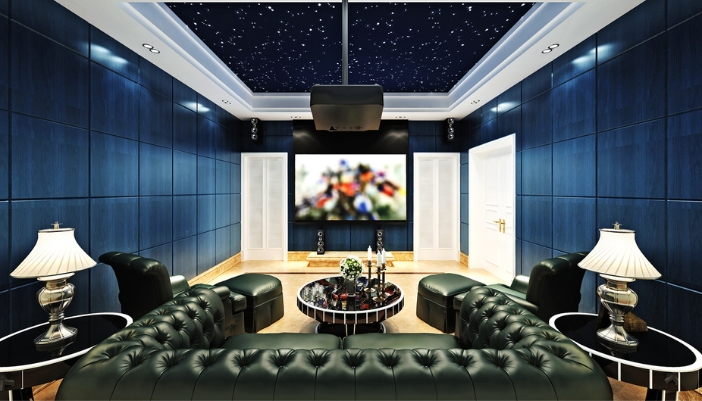 A pole-mounted projector over a luxury seating in home theater