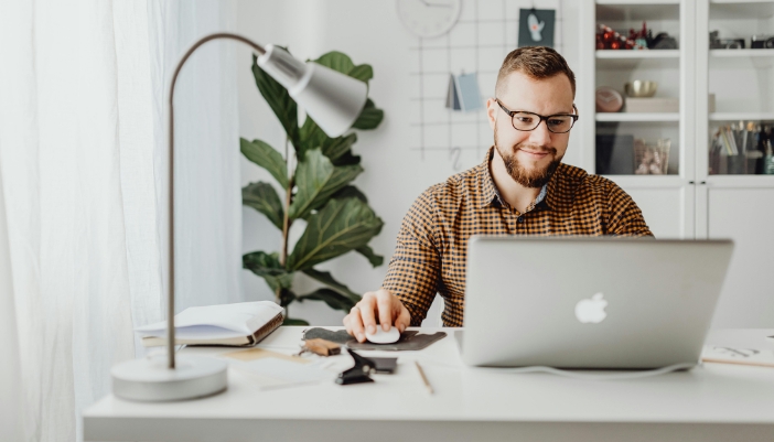 A man is relaxed while working from home at the perfect temperature