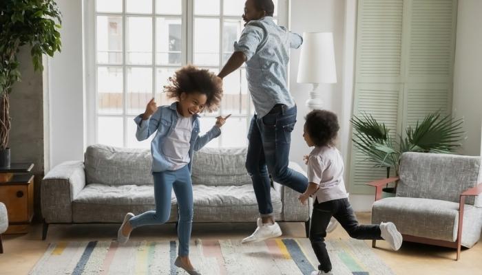 dad and kids dancing in room