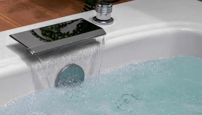 Luxury tub being filled; water sensors monitoring everything