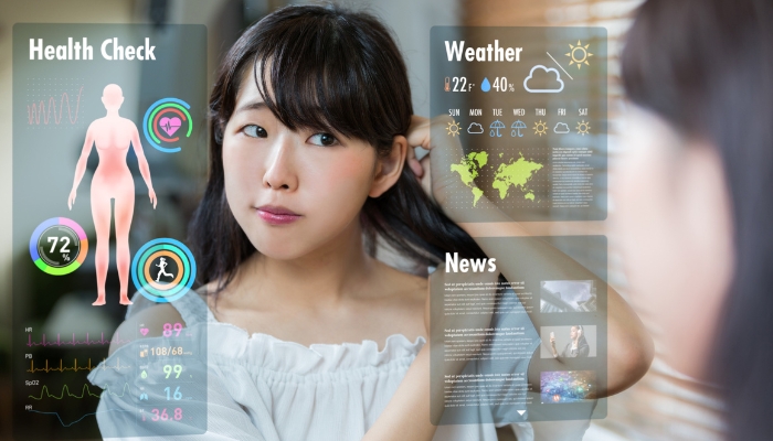 Woman using smart mirror TV to start her day