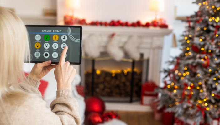 Woman using smart panel to control her home
