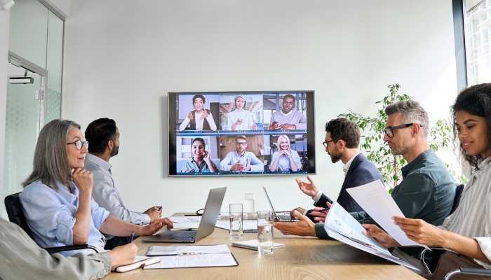 A video conference happening in a conference room enhanced by smart technology
