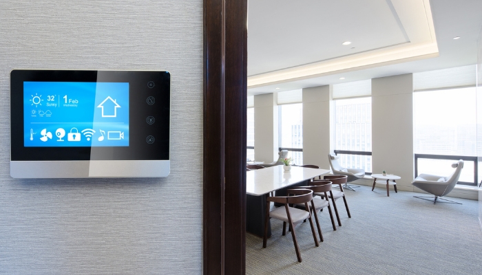  Smart panel in front of smart conference room; lighting, shades, and temperature set just right for a meeting