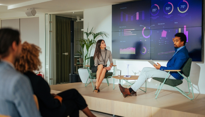 Two people giving a presentation with integrated audio