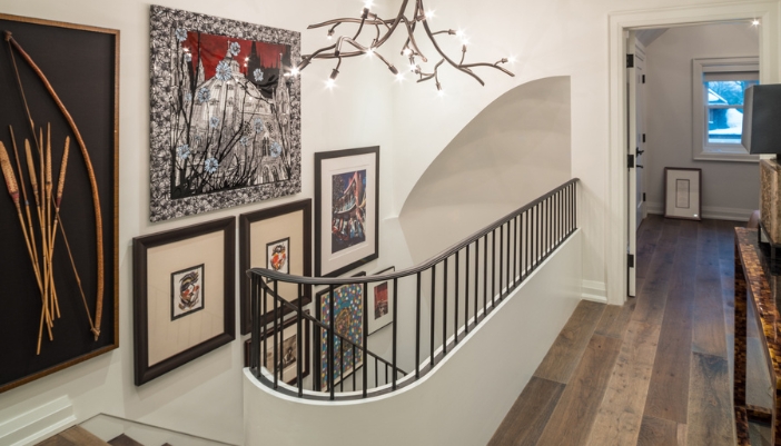hallway art display on stairs